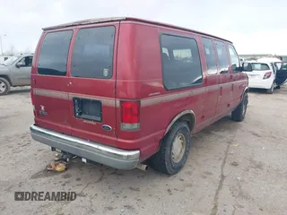 1999 Ford Econoline Cargo with VIN 1FDRE14W0XHB06565, listed as a IAAI auction lot 41496511 with 165,268 mi miles. Bid and sale history available at carsss.com. Image 4.