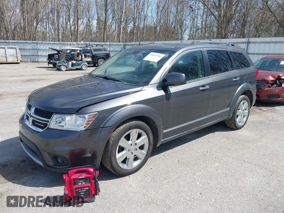 2014 Dodge Journey Limited with VIN 3C4PDDDG7ET138601, listed as a IAAI auction lot 42021766 with 214,220 mi miles and . Bid and sale history available at carsss.com. Image 2.