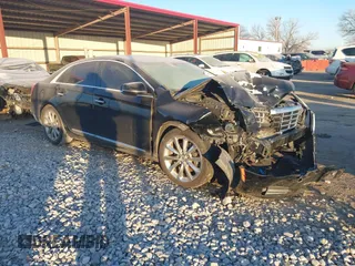 2014 Cadillac XTS Luxury with VIN 2G61M5S32E9289279, listed as a IAAI auction lot 41279495 with 106,655 mi miles. Bid and sale history available at carsss.com. Image 1.