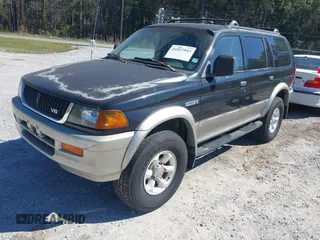 1999 Mitsubishi Montero Sport LS with VIN JA4LS31H7XP018312, listed as a IAAI auction lot 41827943 with 204,814 mi miles. Bid and sale history available at carsss.com. Image 2.