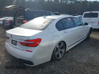 2017 BMW 7 Series 750i with VIN WBA7F0C58HGM21467, listed as a IAAI auction lot 41632663 with 136,620 mi miles. Bid and sale history available at carsss.com. Image 4.