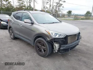 2017 Hyundai Santa Fe 2.4L z VIN 5NMZU3LB1HH025799, wystawiony jako IAAI lot #40928781 z przebiegiem 181 047 mil mil oraz . Historia ofert i sprzedaży dostępna na DreamBid. Obrazek 1.