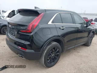 2023 Cadillac XT4 FWD Luxury with VIN 1GYAZAR49PF128552, listed as a IAAI auction lot 41806172 with 36,081 mi miles and . Bid and sale history available at carsss.com. Image 4.