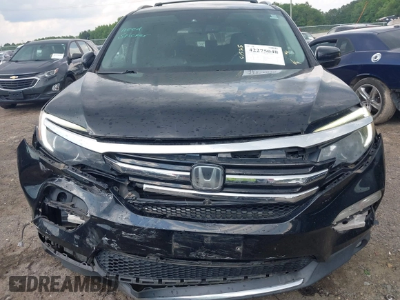 2017 Honda Pilot Touring with VIN 5FNYF5H99HB037126, listed as a IAAI auction lot 42275048 with 164,289 mi miles and . Bid and sale history available at DreamBid. Image 12.