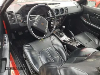 1984 Nissan 300ZX z VIN JN1CZ14SXEX009648, wystawiony jako Copart lot #56090024 z przebiegiem 48 776 mil mil oraz Szkody całkowita. Historia ofert i sprzedaży dostępna na DreamBid. Obrazek 8.
