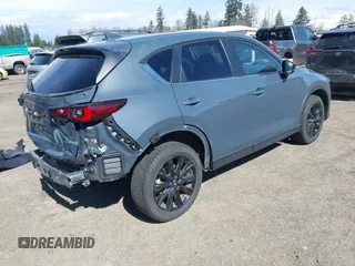 2023 Mazda CX-5 2.5 S Carbon Edition with VIN JM3KFBCM8P0134757, listed as a IAAI auction lot 41893648 with 9,587 mi miles. Bid and sale history available at carsss.com. Image 4.