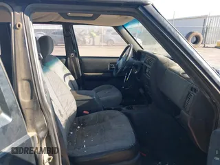 2001 Jeep Cherokee Sport with VIN 1J4FT48SX1L581192, listed as a IAAI auction lot 41828841 with 315,822 mi miles. Bid and sale history available at carsss.com. Image 5.