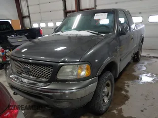 2003 Ford F-150 XL with VIN 1FTRX18W63NB69173, listed as a IAAI auction lot 41618645 with 219,506 mi miles. Bid and sale history available at carsss.com. Image 6.