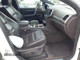 2014 Jeep Grand Cherokee Summit z VIN 1C4RJEJG1EC357948, wystawiony jako IAAI lot #42498652 z przebiegiem 213 715 mil mil oraz . Historia ofert i sprzedaży dostępna na DreamBid. Obrazek 5.
