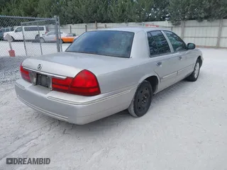 2004 Mercury Grand Marquis GS with VIN 2MEFM74W04X669087, listed as a IAAI auction lot 42090394 with 172,008 mi miles. Bid and sale history available at carsss.com. Image 4.
