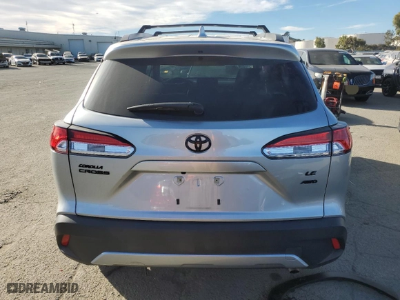 2022 Toyota Corolla Cross LE with VIN 7MUCAABG9NV042753, listed as a Copart auction lot 88469125 with 23,760 mi miles and Salvage Title. Bid and sale history available at carsss.com. Image 6.