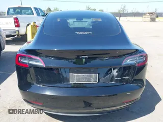 2021 Tesla Model 3 Long Range with VIN 5YJ3E1EB2MF065583, listed as a IAAI auction lot 42067399 with 52,333 mi miles. Bid and sale history available at carsss.com. Image 17.