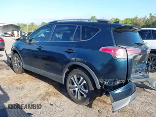 2018 Toyota RAV4 LE with VIN JTMZFREV1JJ203943, listed as a IAAI auction lot 41921863 with 104,691 mi miles. Bid and sale history available at carsss.com. Image 3.