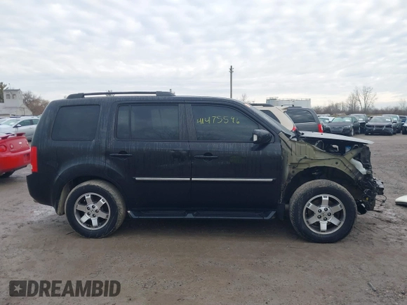 2011 Honda Pilot Touring with VIN 5FNYF4H94BB089930, listed as a IAAI auction lot 41477596 with 171,831 mi miles. Bid and sale history available at carsss.com. Image 14.