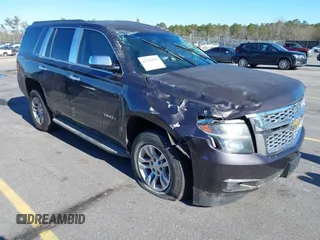2015 Chevrolet Tahoe LS z VIN 1GNSCAKC1FR262411, wystawiony jako IAAI lot #41323792 z przebiegiem 232 259 mil mil oraz . Historia ofert i sprzedaży dostępna na DreamBid. Obrazek 1.