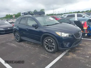 2016 Mazda CX-5 Grand Touring with VIN JM3KE2DYXG0890174, listed as a IAAI auction lot 42157884 with 141,873 mi miles. Bid and sale history available at carsss.com. Image 1.