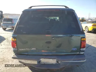 1997 Ford Explorer XL with VIN 1FMDU34E2VZC03015, listed as a Copart auction lot 80654764 with 295,587 mi miles and Salvage title. Bid and sale history available at DreamBid. Image 6.