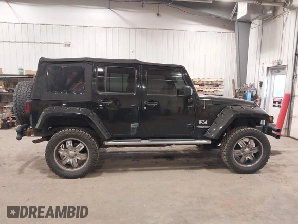 2008 Jeep Wrangler Unlimited X with VIN 1J4GA391X8L558984, listed as a IAAI auction lot 41016498 with 123,308 mi miles. Bid and sale history available at carsss.com. Image 13.