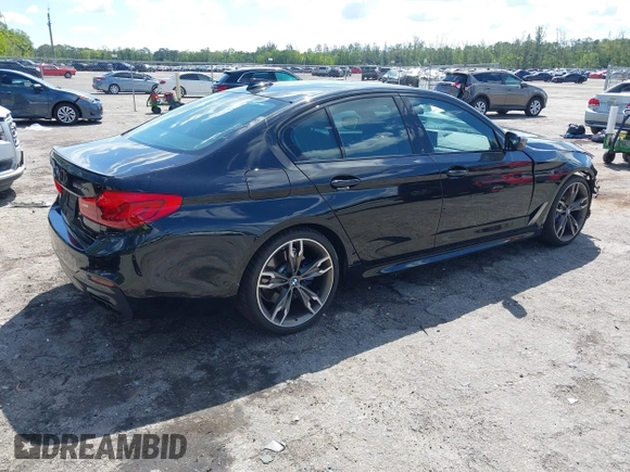 2019 BMW 5 Series M550i xDrive with VIN WBAJB9C51KB289355, listed as a IAAI auction lot 41867984 with 30,106 mi miles and . Bid and sale history available at DreamBid. Image 4.
