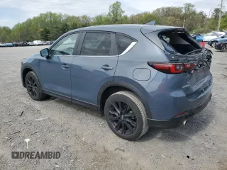 2023 Mazda CX-5 S Carbon Edition z VIN JM3KFBCM9P0158890, wystawiony jako Copart lot #53839045 z przebiegiem 26 623 mil mil oraz Szkody całkowita. Historia ofert i sprzedaży dostępna na DreamBid. Obrazek 2.