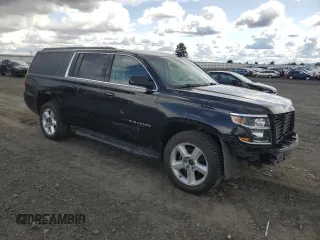 2018 Chevrolet Suburban LT with VIN 1GNSKHKC0JR266132, listed as a Copart auction lot 51337275 with 197,386 mi miles and Salvage Title. Bid and sale history available at DreamBid. Image 4.