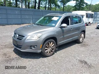 2010 Volkswagen Tiguan S with VIN WVGBV7AX1AW532415, listed as a IAAI auction lot 42561683 with 106,147 mi miles and . Bid and sale history available at DreamBid. Image 2.