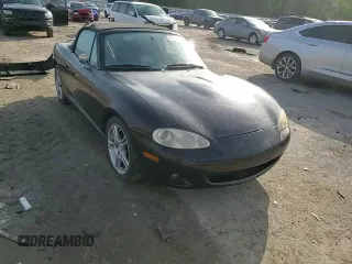 2004 Mazda MX-5 Miata LS with VIN JM1NB353140408906, listed as a Copart auction lot 56664715 with 86,603 mi miles and Salvage title. Bid and sale history available at DreamBid. Image 14.
