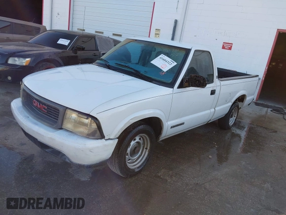 1999 GMC Sonoma with VIN 1GTCS1448XK513781, listed as a IAAI auction lot 41604322 with 216,174 mi miles. Bid and sale history available at carsss.com. Image 2.