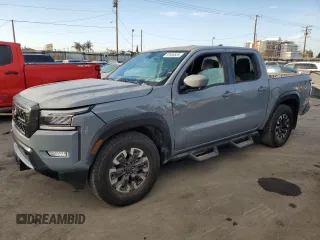 2024 Nissan Frontier Pro-X z VIN 1N6ED1EJ1RN615039, wystawiony jako Copart lot #87690525 z przebiegiem 28 592 mil mil oraz Szkoda całkowita • Salvage title. Historia ofert i sprzedaży dostępna na DreamBid. Obrazek 1.