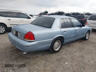 1999 Ford Crown Victoria z VIN 2FAFP73WXXX221069, wystawiony jako IAAI lot #41750127 z przebiegiem 177 142 mil mil oraz . Historia ofert i sprzedaży dostępna na DreamBid. Obrazek 4.
