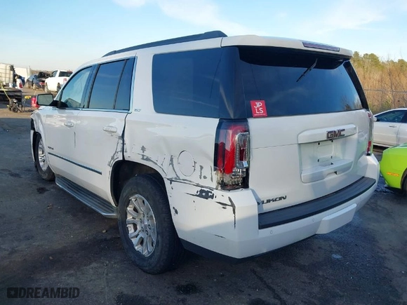 2017 GMC Yukon SLT with VIN 1GKS1BKC5HR214101, listed as a IAAI auction lot 41273942 with 144422 miles. Bid and sale history available at carsss.com. Image 3.