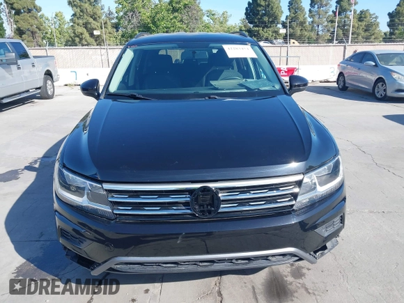 2018 Volkswagen Tiguan S with VIN 3VV1B7AX1JM091928, listed as a IAAI auction lot 42283454 with 53,650 mi miles and . Bid and sale history available at DreamBid. Image 12.