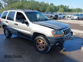 2000 Jeep Grand Cherokee Laredo z VIN 1J4GW48S8YC244168, wystawiony jako IAAI lot #41907447 z przebiegiem 243 154 mil mil oraz . Historia ofert i sprzedaży dostępna na DreamBid. Obrazek 1.