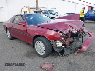 1988 Toyota Supra z VIN JT2MA70J7J0089298, wystawiony jako IAAI lot #40577741 z przebiegiem 174 642 mil mil oraz . Historia ofert i sprzedaży dostępna na DreamBid. Obrazek 1.