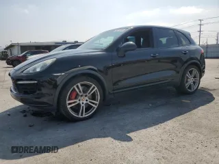 2011 Porsche Cayenne Turbo z VIN WP1AC2A26BLA82226, wystawiony jako Copart lot #65241815 z przebiegiem 127 296 mil mil oraz Czysty tytuł • Clean title. Historia ofert i sprzedaży dostępna na DreamBid. Obrazek 1.