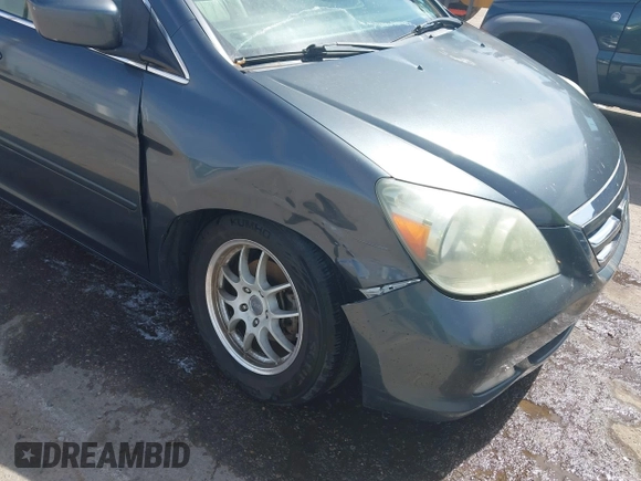 2005 Honda Odyssey TOURING with VIN 5FNRL38855B091754, listed as a IAAI auction lot 42131326 with 258,635 mi miles. Bid and sale history available at carsss.com. Image 6.