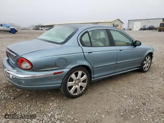 2004 Jaguar X-Type with VIN SAJEA51C04WD73149, listed as a Copart auction lot 74020364 with 118,034 mi miles and Salvage Title. Bid and sale history available at carsss.com. Image 3.