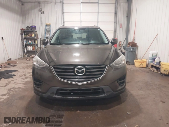 2016 Mazda CX-5 Grand Touring with VIN JM3KE4DY0G0732843, listed as a IAAI auction lot 41520889 with 149,798 mi miles. Bid and sale history available at carsss.com. Image 12.