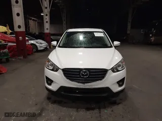 2016 Mazda CX-5 Touring with VIN JM3KE4CY0G0853261, listed as a IAAI auction lot 41861176 with 63,491 mi miles. Bid and sale history available at carsss.com. Image 12.