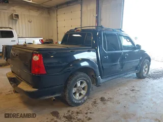 2005 Ford Explorer Sport Trac XLS with VIN 1FMZU77K45UB32573, listed as a IAAI auction lot 41760637 with 216,186 mi miles. Bid and sale history available at carsss.com. Image 4.