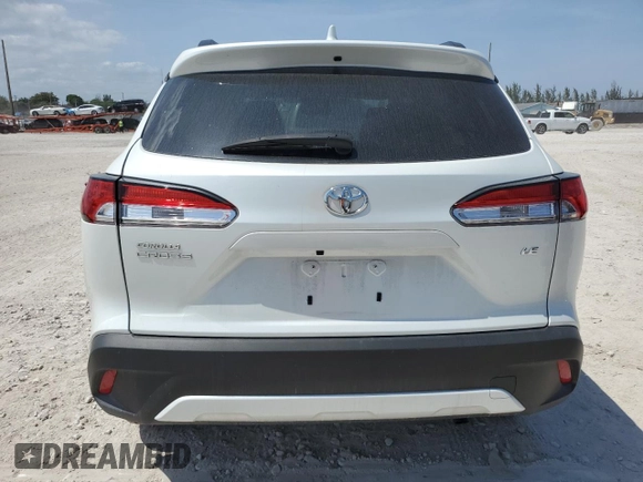 2024 Toyota Corolla Cross LE with VIN 7MUCAAAG7RV090677, listed as a Copart auction lot 57615565 with 6,910 mi miles and Salvage title. Bid and sale history available at DreamBid. Image 6.