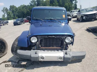 2009 Jeep Wrangler Sahara with VIN 1J4FA54199L747528, listed as a Copart auction lot 80974584 with 226,299 mi miles and Salvage title. Bid and sale history available at DreamBid. Image 5.