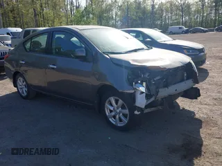 2014 Nissan Versa SV with VIN 3N1CN7AP2EL877539, listed as a IAAI auction lot 42107642 with 122,616 mi miles. Bid and sale history available at carsss.com. Image 1.