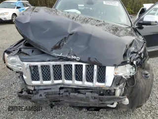 2013 Jeep Grand Cherokee Overland with VIN 1C4RJFCGXDC643802, listed as a Copart auction lot 52429535 with 122,014 mi miles and Salvage Title. Bid and sale history available at carsss.com. Image 13.