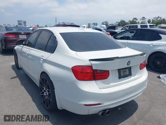 2014 BMW 3 Series 328i with VIN WBA3C1C52EK110753, listed as a IAAI auction lot 42444129 with 169,035 mi miles and . Bid and sale history available at DreamBid. Image 3.