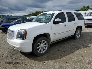 2014 GMC Yukon Denali with VIN 1GKS2EEF1ER212412, listed as a Copart auction lot 50954565 with 115,964 mi miles and Salvage Title. Bid and sale history available at carsss.com. Image 1.