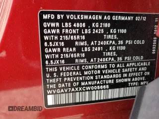 2012 Volkswagen Tiguan SE z VIN WVGAV7AXXCW005665, wystawiony jako Copart lot #58413145 z przebiegiem 197 505 mil mil oraz Tytuł czysty. Historia ofert i sprzedaży dostępna na DreamBid. Obrazek 13.
