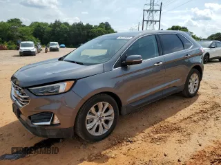2022 Ford Edge Titanium z VIN 2FMPK4K9XNBA09995, wystawiony jako Copart lot #57318465 z przebiegiem 105 496 mil mil oraz Szkoda całkowita • Salvage title. Historia ofert i sprzedaży dostępna na DreamBid. Obrazek 1.