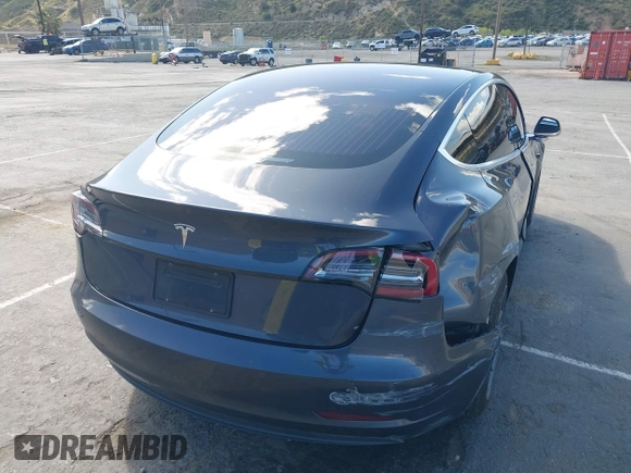 2019 Tesla Model 3 Mid Range with VIN 5YJ3E1EA6KF307456, listed as a IAAI auction lot 41944454 with 99,059 mi miles and . Bid and sale history available at DreamBid. Image 4.