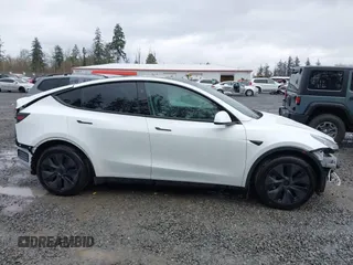 2025 Tesla Model Y Long Range with VIN 7SAYGDEDXSF248734, listed as a IAAI auction lot 41719195 with 5,876 mi miles and . Bid and sale history available at DreamBid. Image 13.